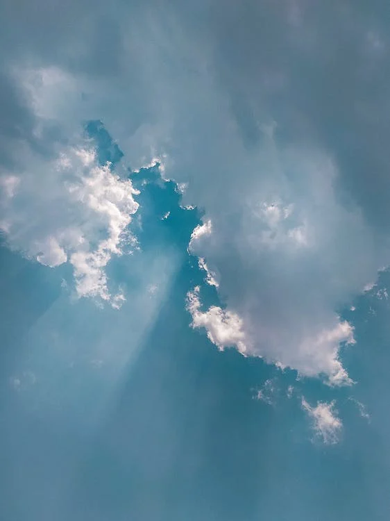 sunray going through clouds in the sky