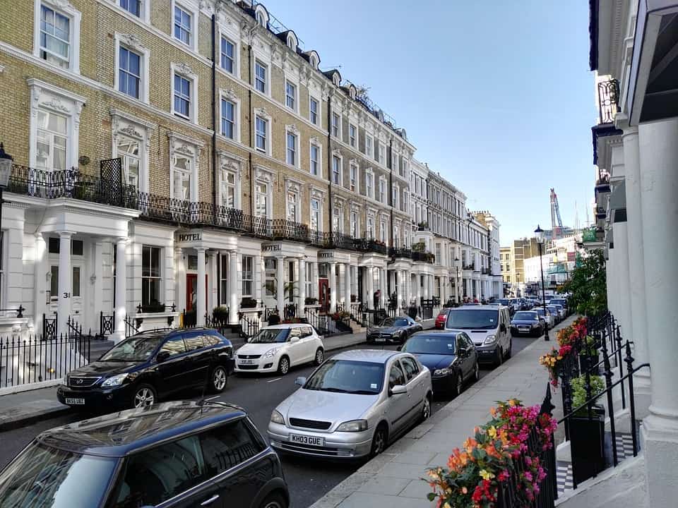 A street of London flats lit by the sun