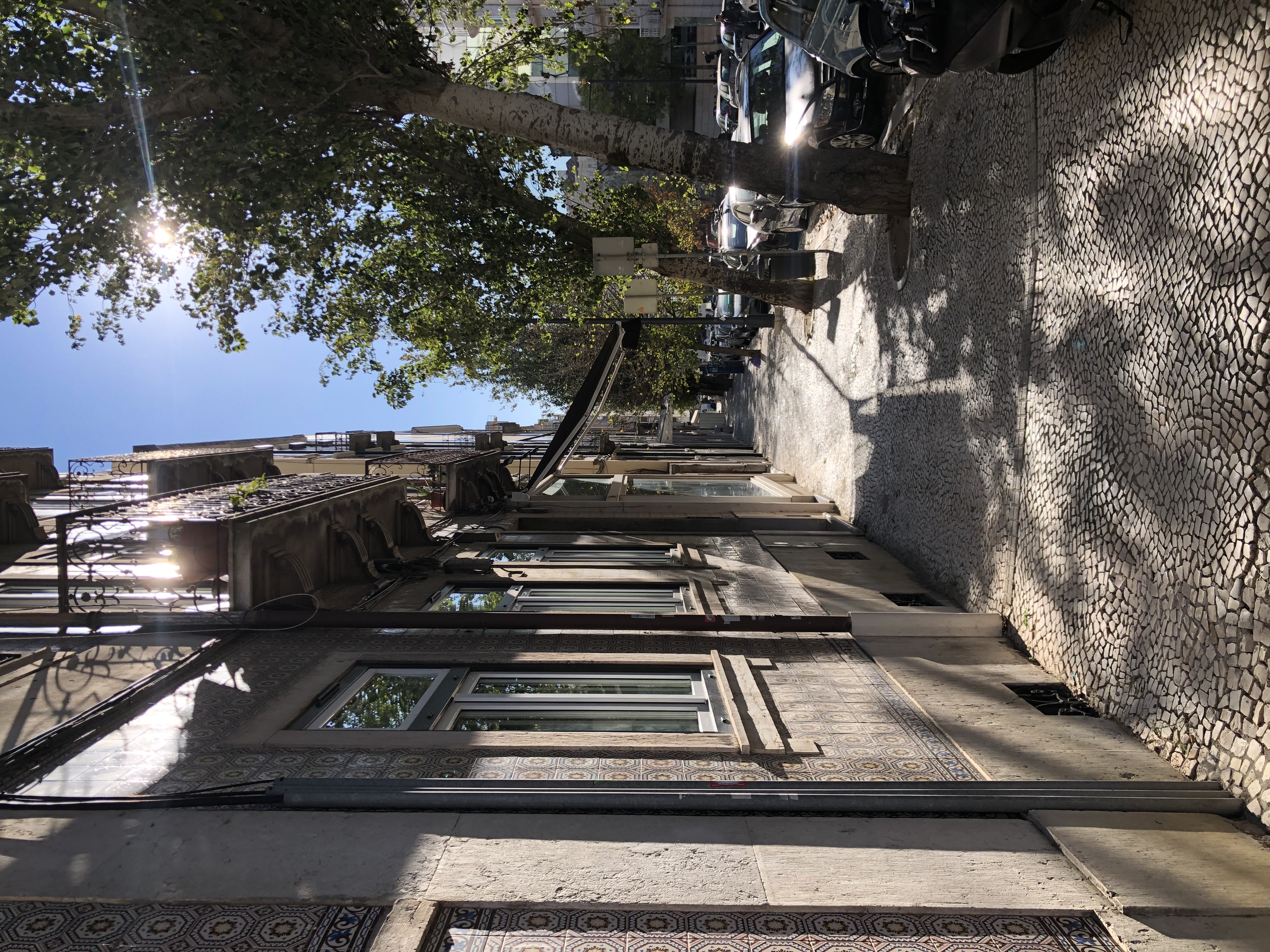 Sunny street near the inner courtyard in the shade