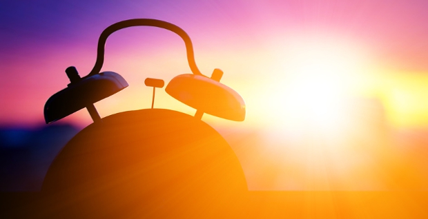 alarm clock illuminated by the sun at dusk